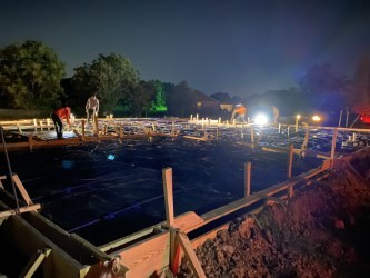Working on Residential Foundation in Night Working on Residential Foundation in Night